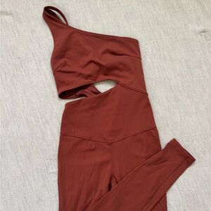 Free people movement one shoulder back cut out orange jumpsuit